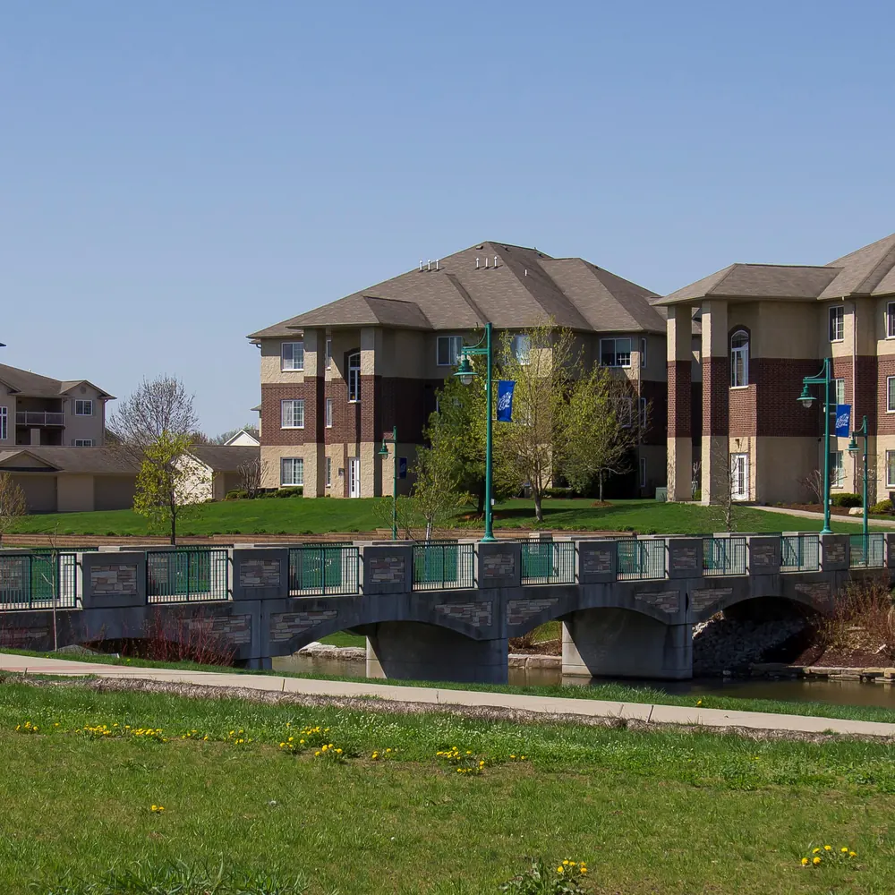 Liberty Centre park trail, pond and nearby homes in North Liberty, Iowa