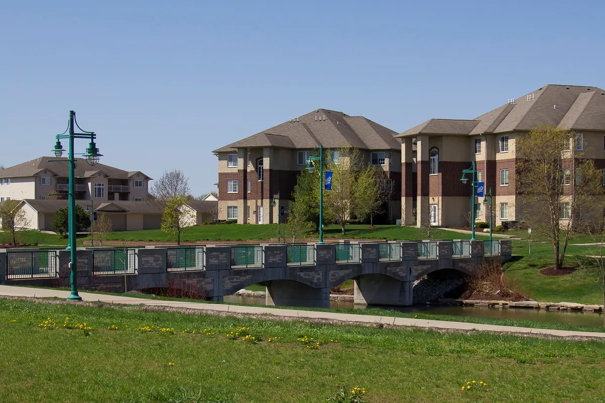 Liberty Centre park trail, pond and nearby homes in North Liberty, Iowa